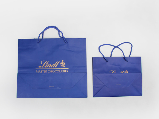 Sacos de papel personalizados com revestimento brilhante C1S C2S Sacos de papel para compras de vestuário azul marinho